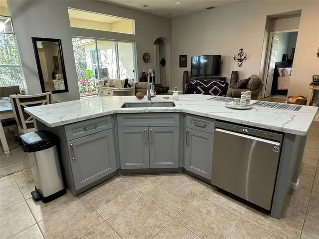 a kitchen with sink cabinets and window