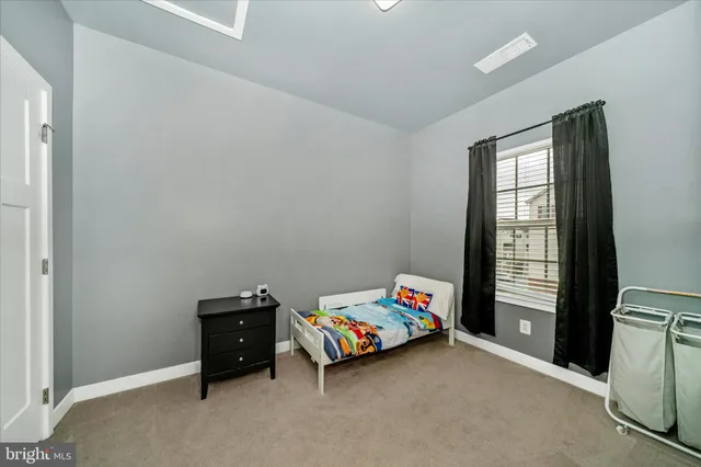 a children room with toys and a window