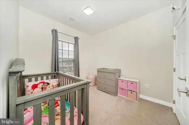 a view of staircase with rug