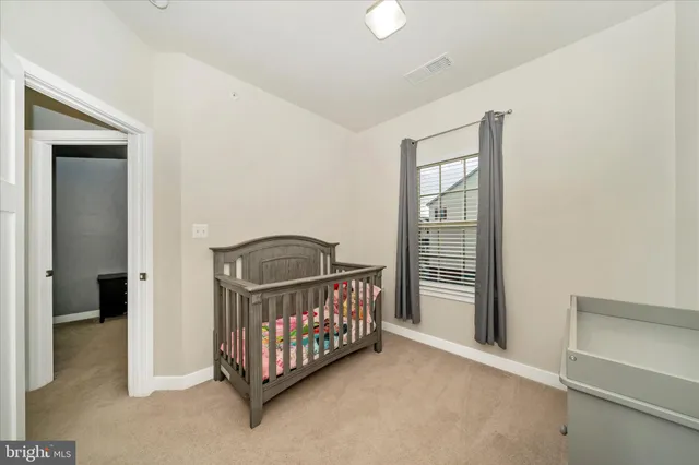 a bathroom with a sink toilet and mirror
