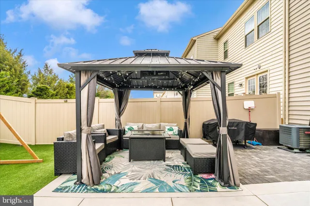 a view of a house with a backyard and a slide