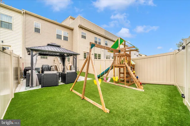 a view of a patio with couches chairs and potted plants