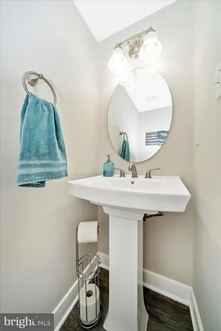 a bathroom with a sink a mirror and vanity