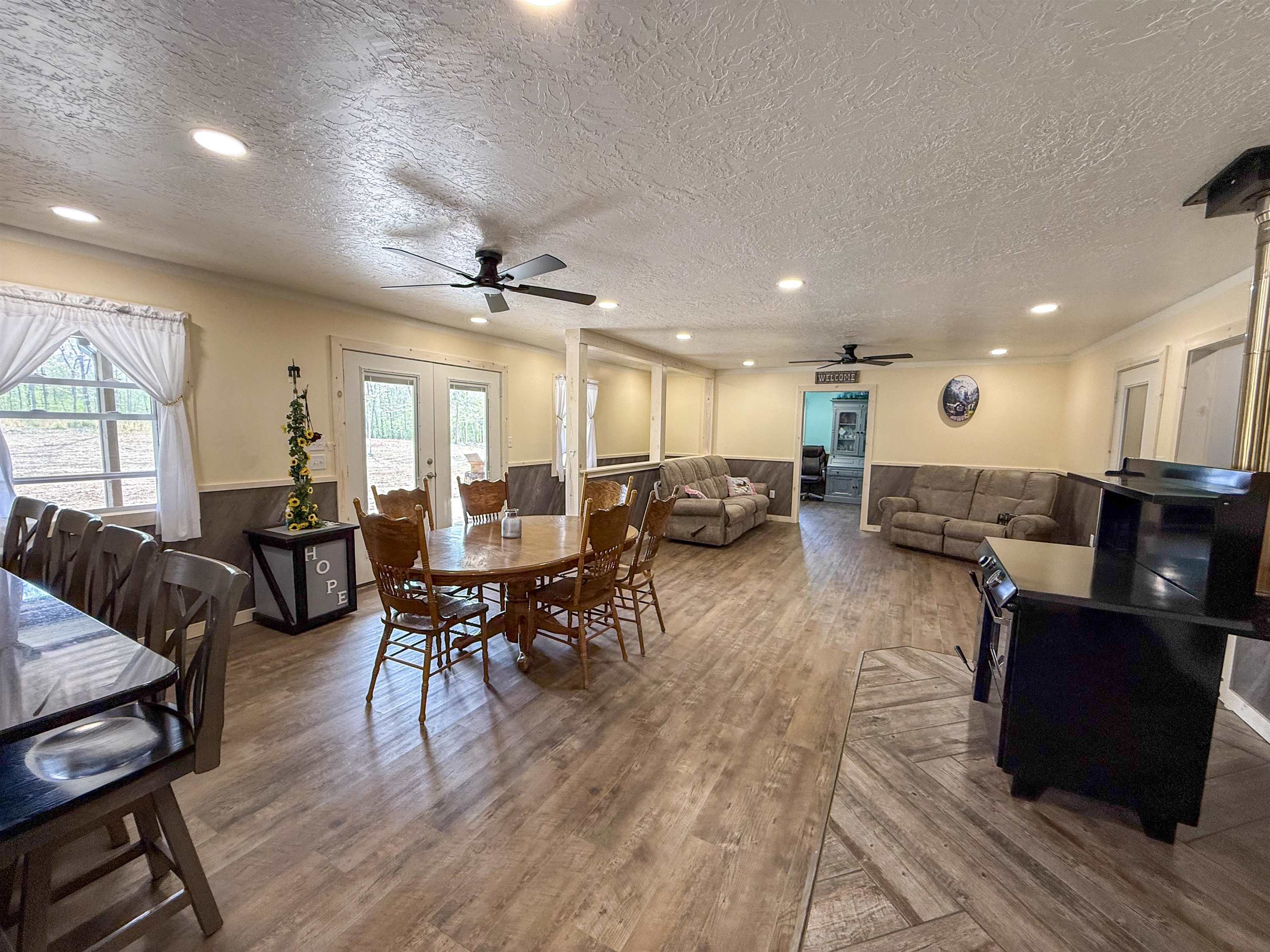 625 Atchison Road Springville, TN 38256 - Photo 24 of 40 a living room with furniture a wooden floor and a sink