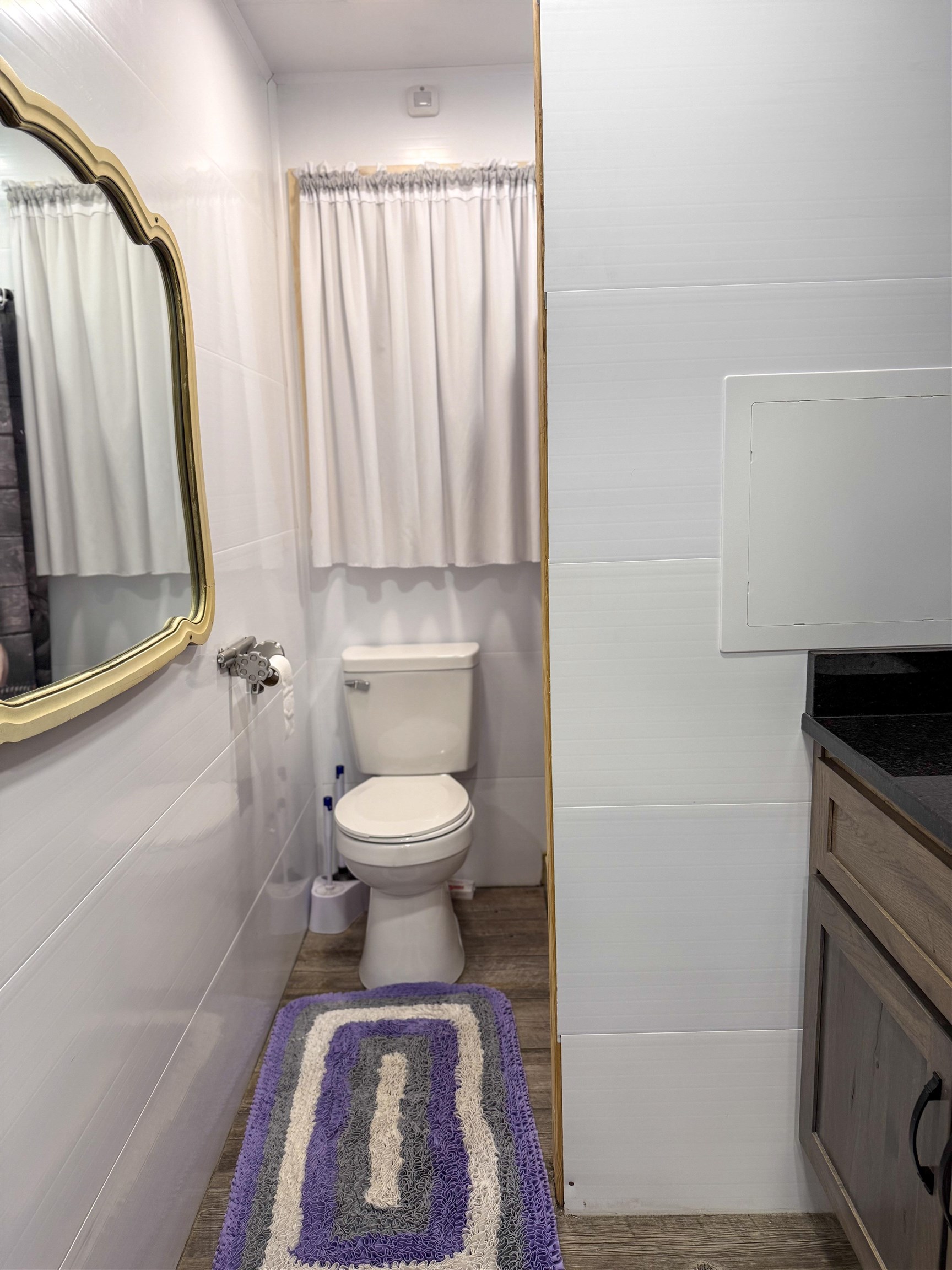 625 Atchison Road Springville, TN 38256 - Photo 30 of 40 a white toilet sitting next to a bathroom sink