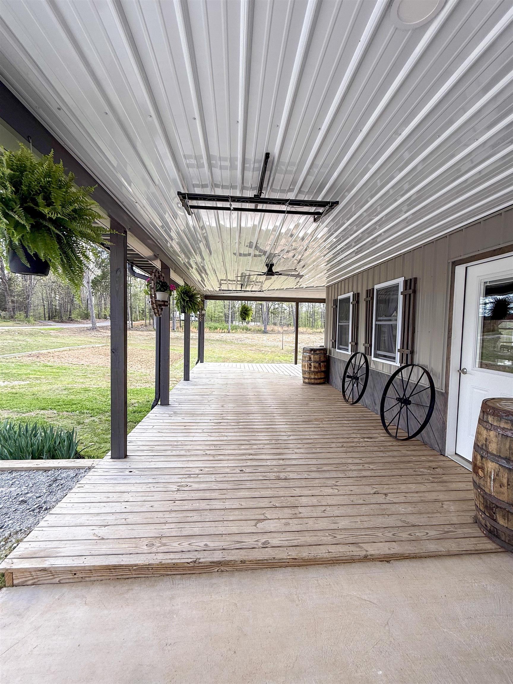 625 Atchison Road Springville, TN 38256 - Photo 4 of 40 a view of a porch with wooden floor