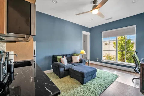 a view of a livingroom with a fireplace and window