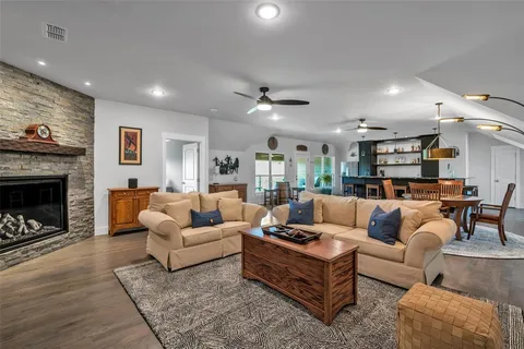 a view of a livingroom with furniture window and wooden floor