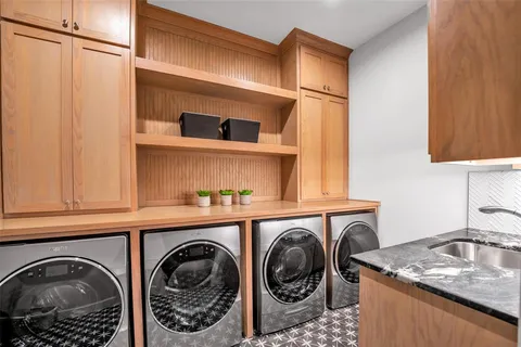 a view of a patio with table and chairs and potted plants
