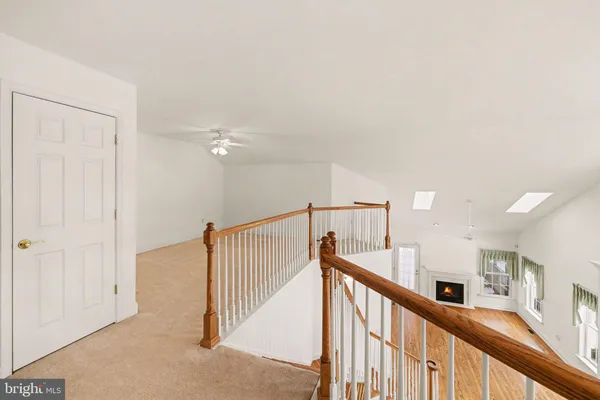 a view of a hallway with staircase