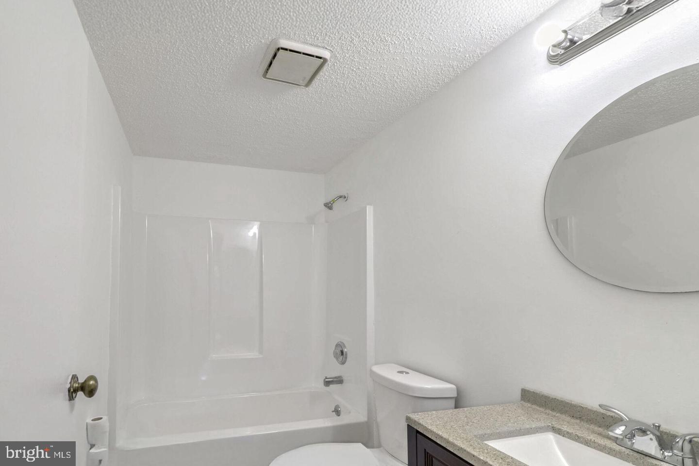 1711 Jacobs Meadow Drive Severn, MD 21144 - Photo 13 of 16 a bathroom with a toilet a sink and bathtub