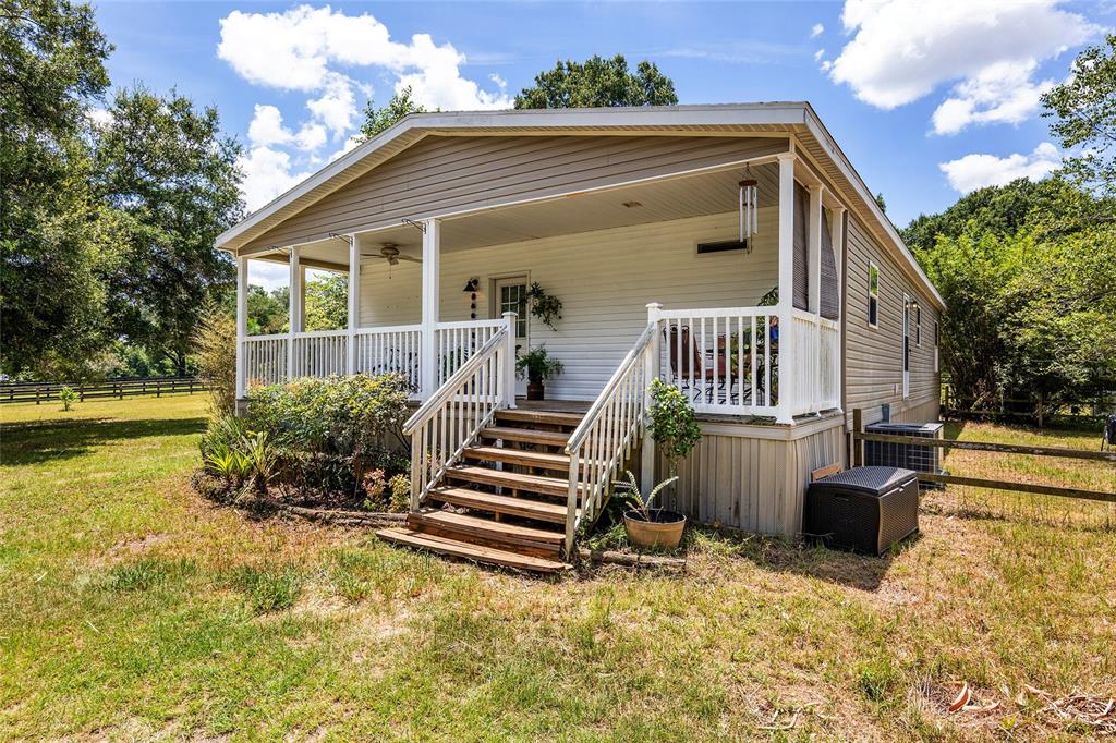8210 Southwest 34th Place Ocala, FL 34481 - Photo 1 of 1 a front view of a house with a yard