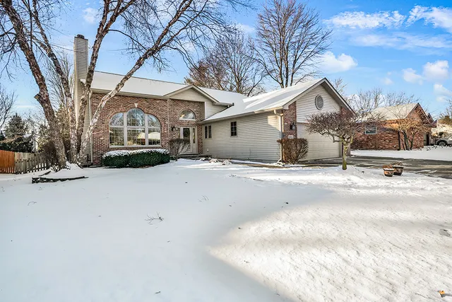 a view of a house with a snow in the yard
