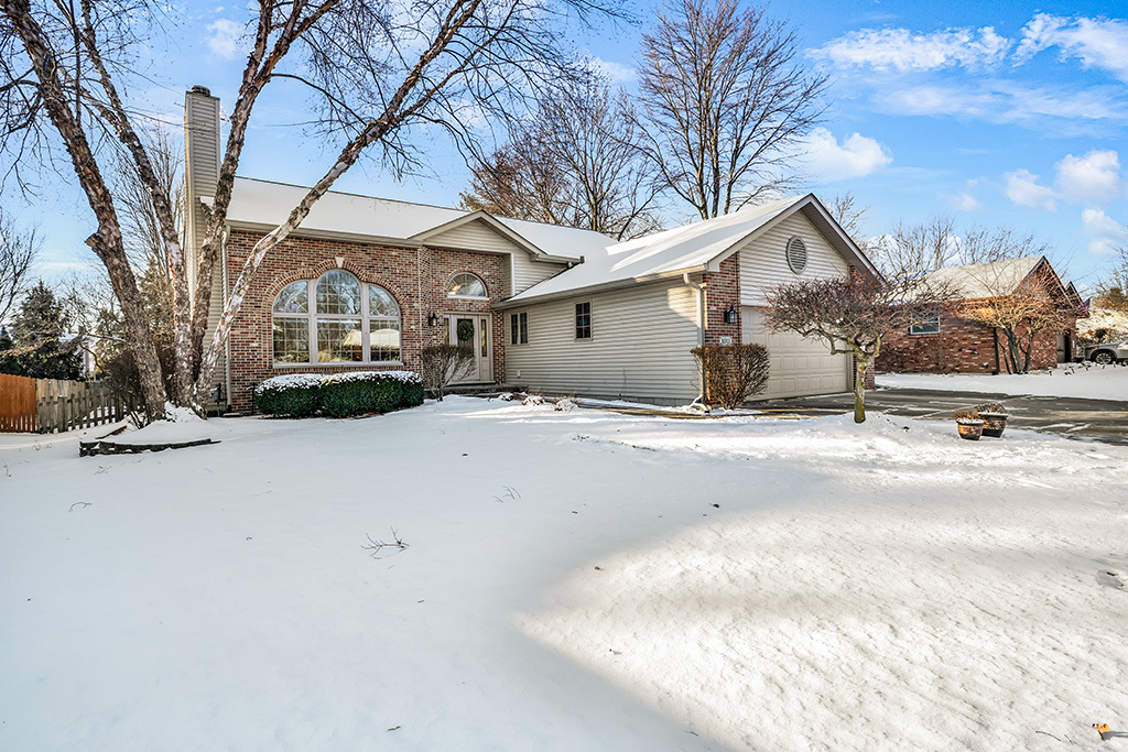 1011 Ranchwood Drive Shorewood, IL 60404 - Photo 1 of 18 a view of a house with a snow in the yard