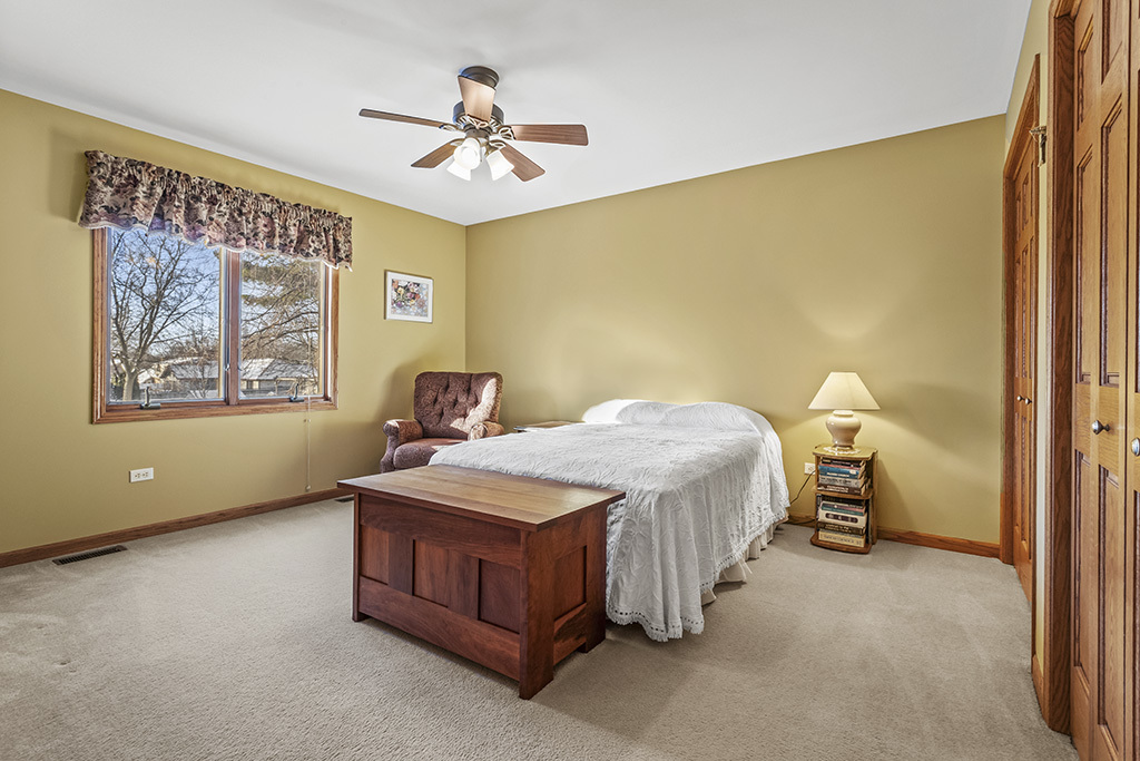 1011 Ranchwood Drive Shorewood, IL 60404 - Photo 12 of 18 a bedroom with a bed and a painting on the wall