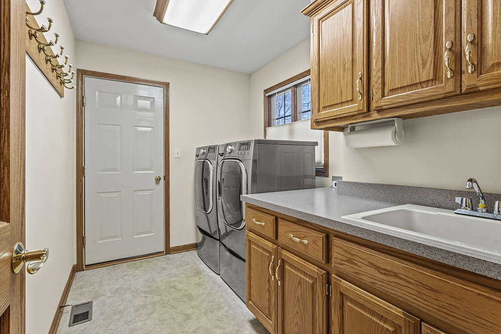 1011 Ranchwood Drive Shorewood, IL 60404 - Photo 5 of 18 a kitchen with stainless steel appliances granite countertop a refrigerator and a sink