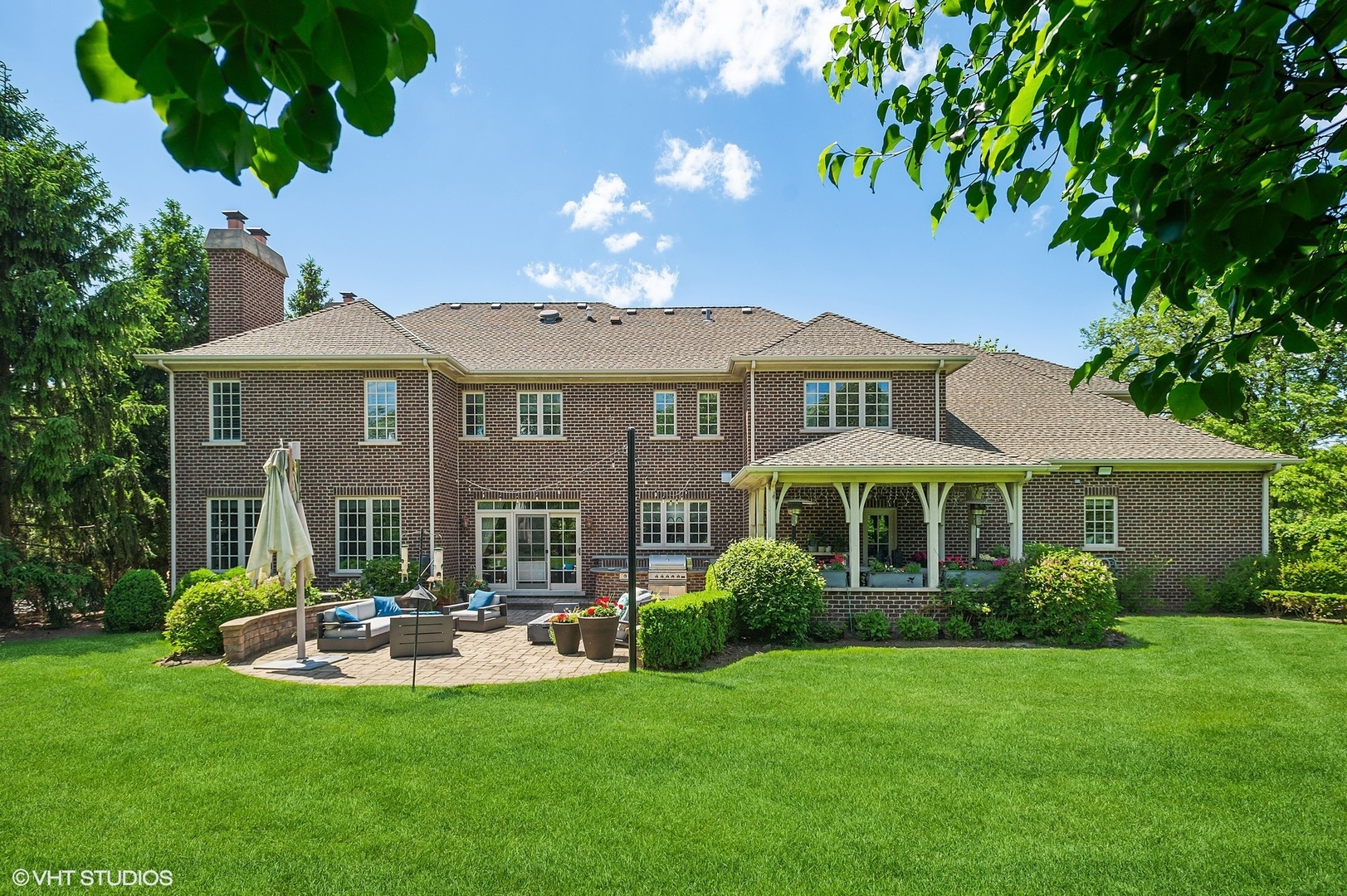 733 York Road Glenview, IL 60025 - Photo 17 of 21 a front view of a house with swimming pool having outdoor seating