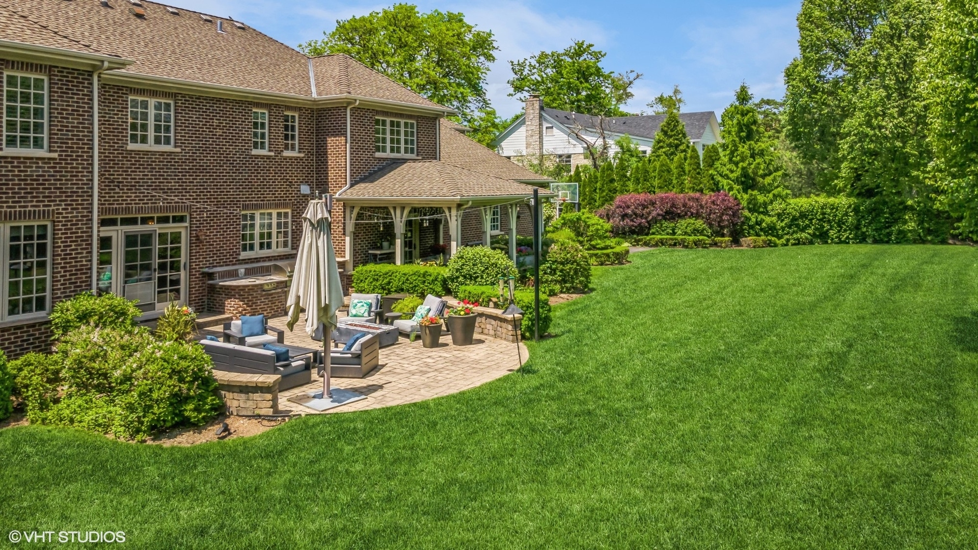 733 York Road Glenview, IL 60025 - Photo 18 of 21 a view of a house with backyard sitting area and garden
