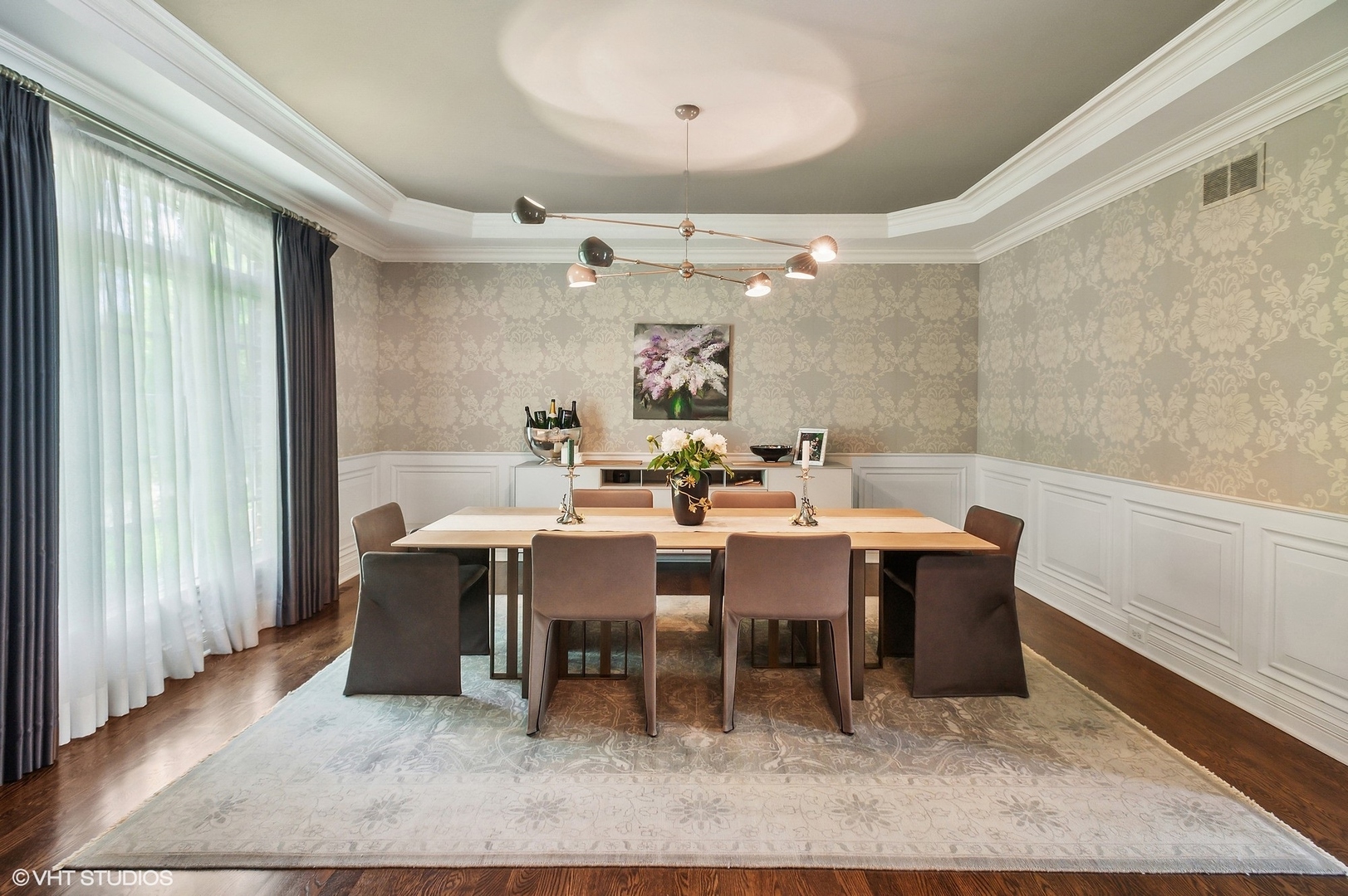 733 York Road Glenview, IL 60025 - Photo 6 of 21 a dining room with wooden floor a chandelier a wooden table and chairs