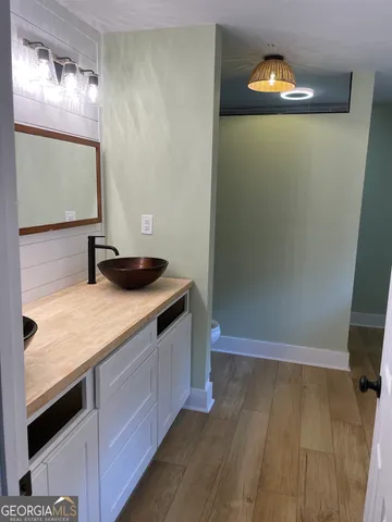 a bathroom with a sink and a mirror