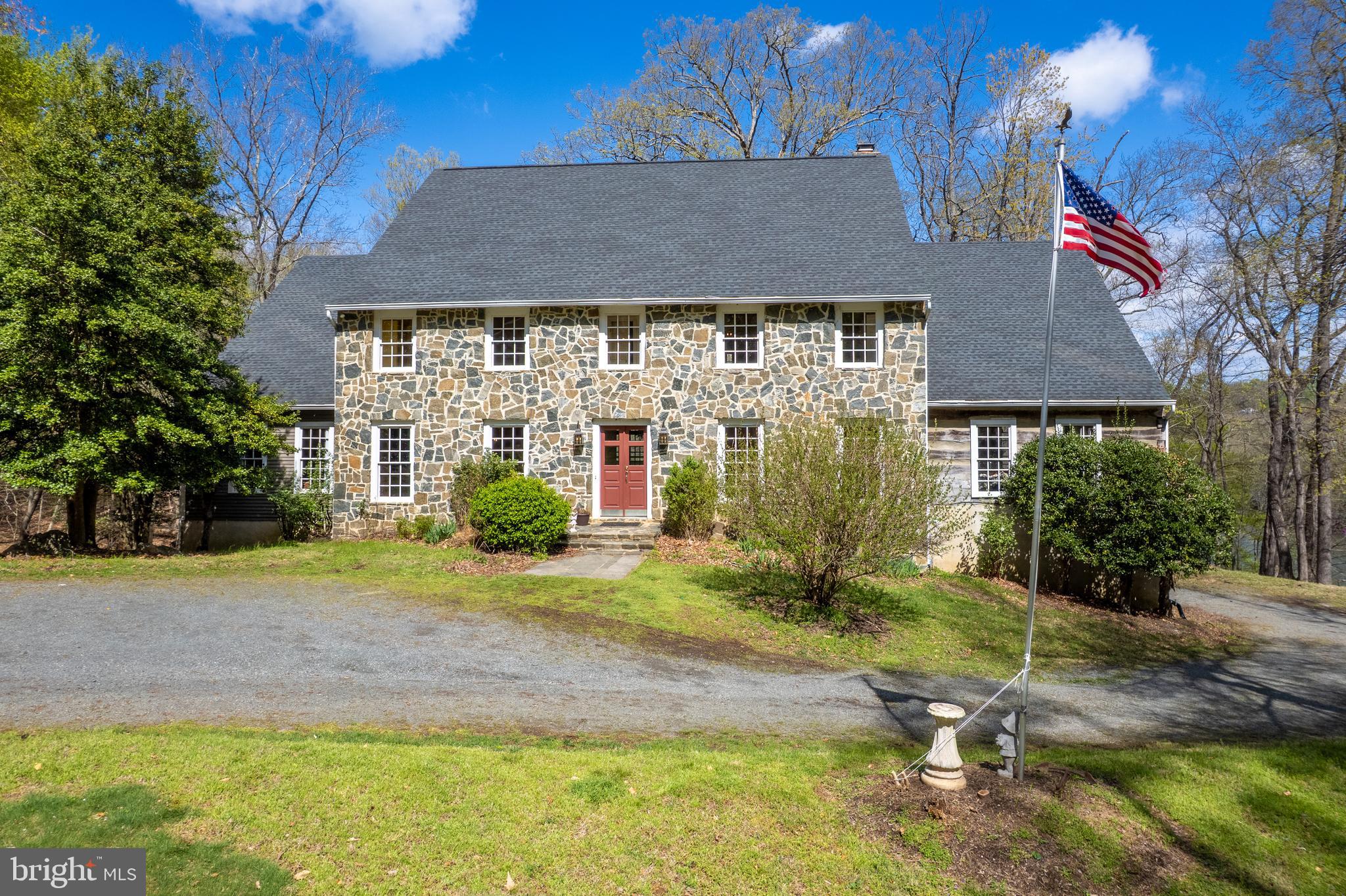a view of a house with a yard and garage