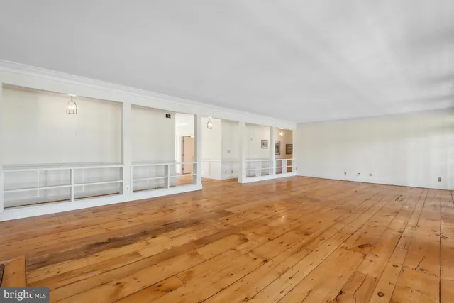a view of an empty room with wooden walls