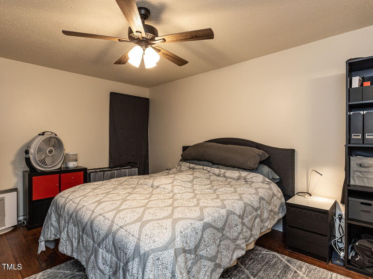 1955 Ranch Road Clayton, NC 27520 - Photo 12 of 28 a bedroom with a bed and a chandelier