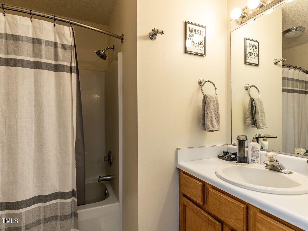 1955 Ranch Road Clayton, NC 27520 - Photo 15 of 28 a bathroom with a sink double vanity and a mirror