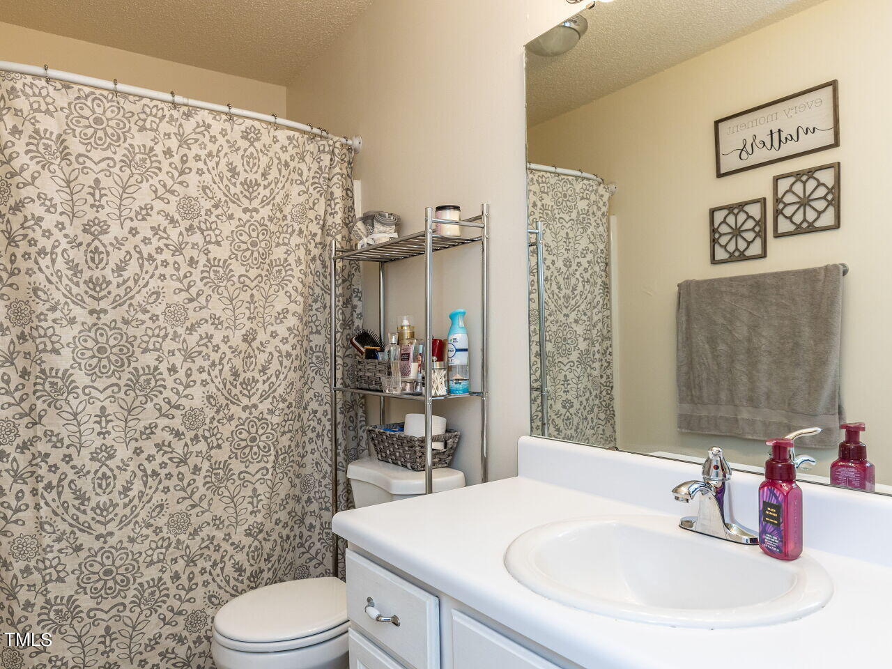 1955 Ranch Road Clayton, NC 27520 - Photo 20 of 28 a bathroom with a sink toilet and shower