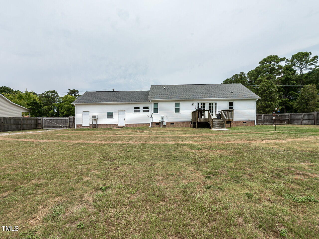 1955 Ranch Road Clayton, NC 27520 - Photo 25 of 28 a big room with lots of trees