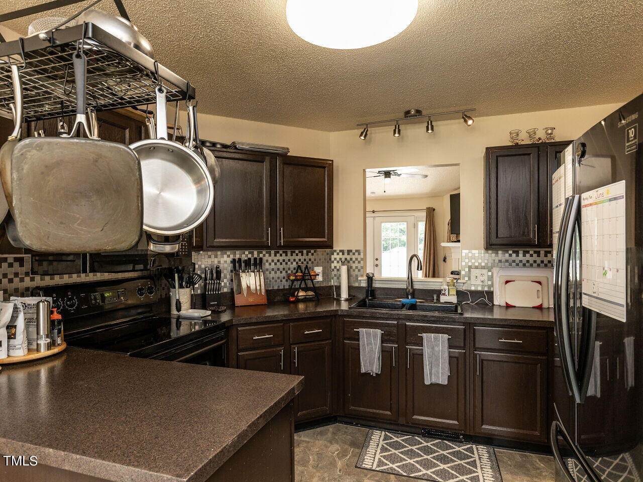 1955 Ranch Road Clayton, NC 27520 - Photo 7 of 28 a kitchen with a sink appliances and cabinets