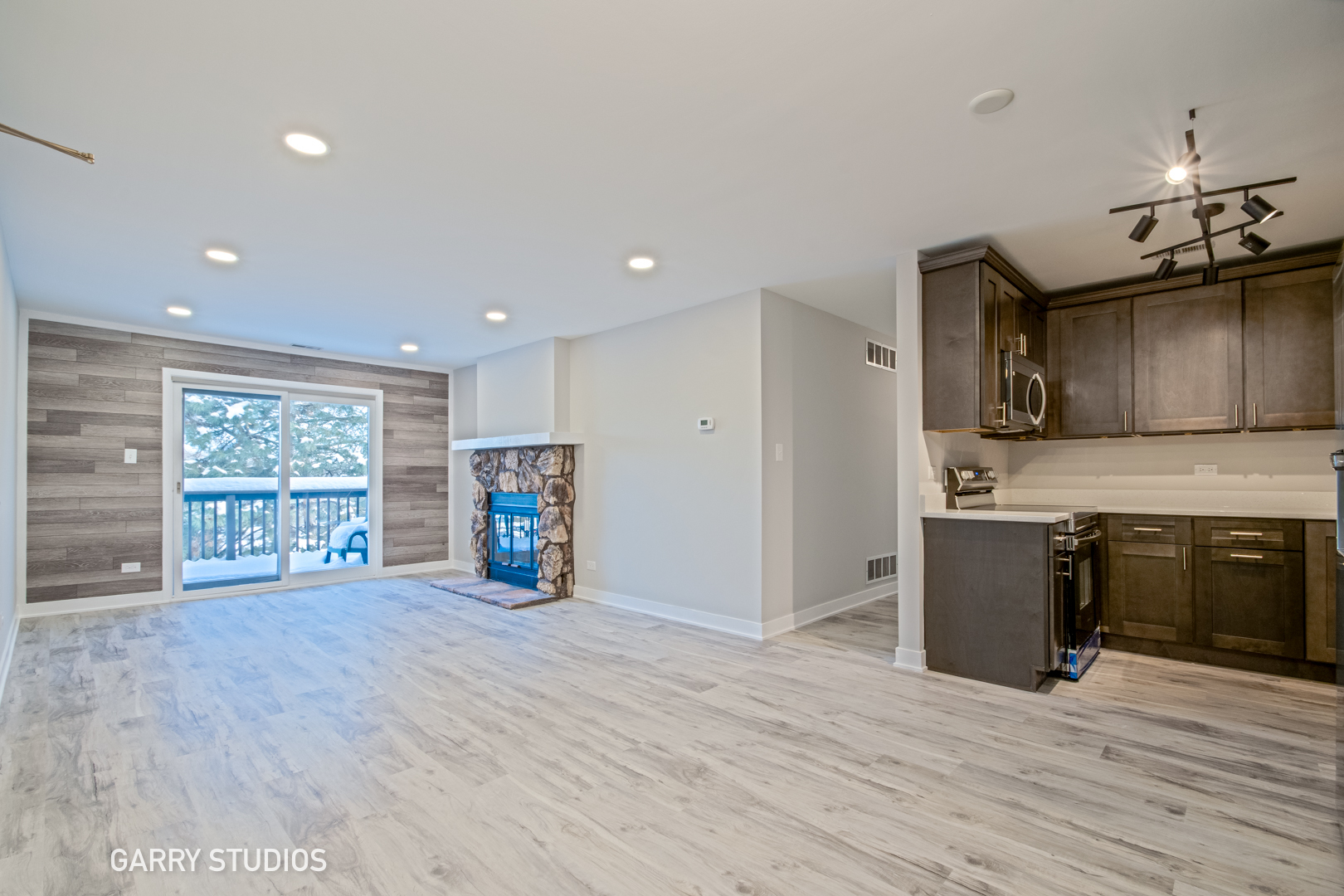 1460 Stonebridge Circle, Unit G9 Wheaton, IL 60189 - Photo 3 of 14 a view of a kitchen with a stove and a window