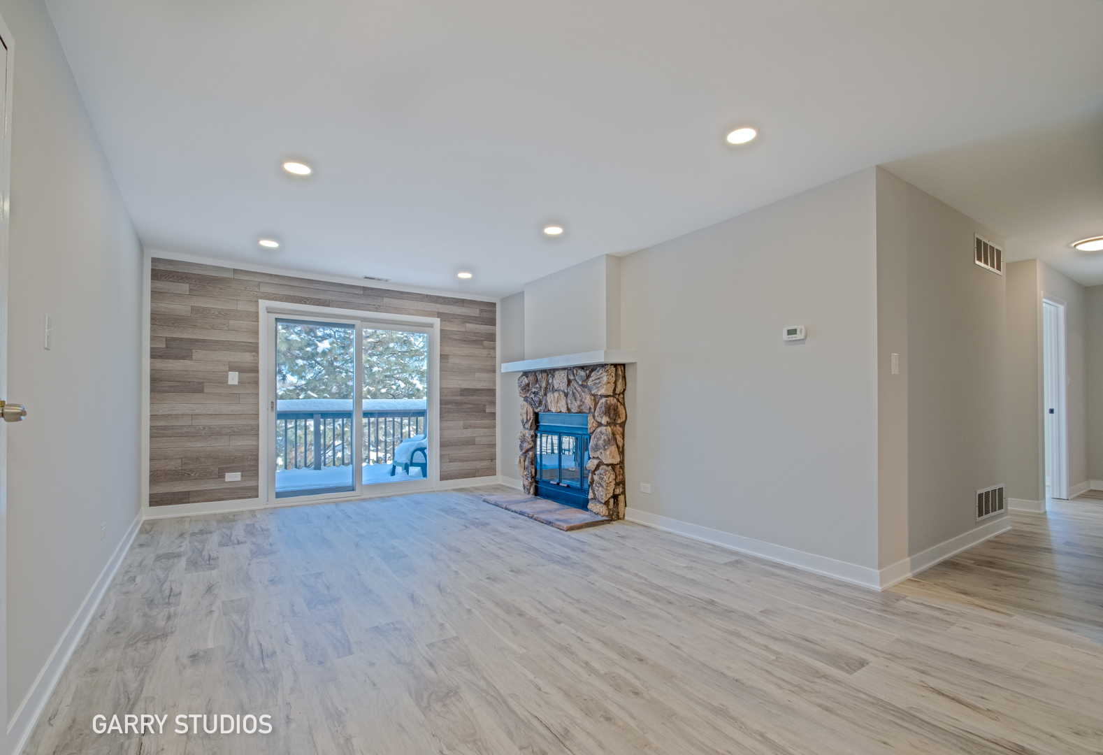 1460 Stonebridge Circle, Unit G9 Wheaton, IL 60189 - Photo 4 of 14 a view of an empty room with a window and wooden floor