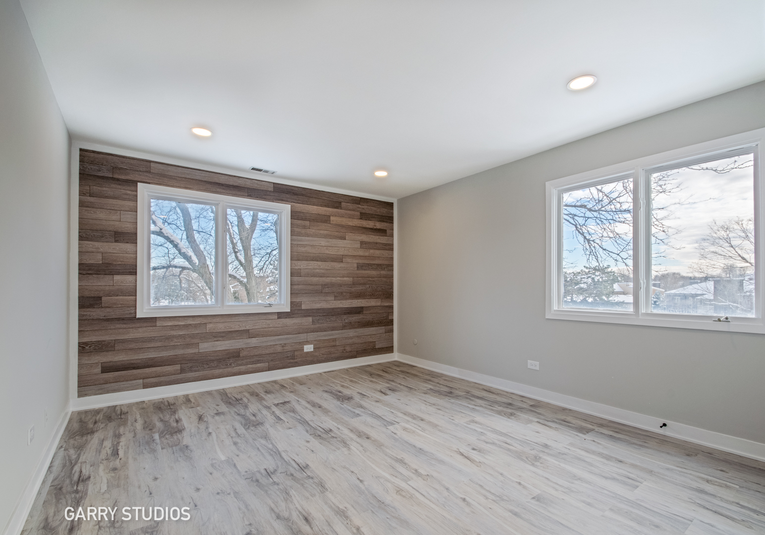 1460 Stonebridge Circle, Unit G9 Wheaton, IL 60189 - Photo 8 of 14 a view of empty room with wooden floor and fan