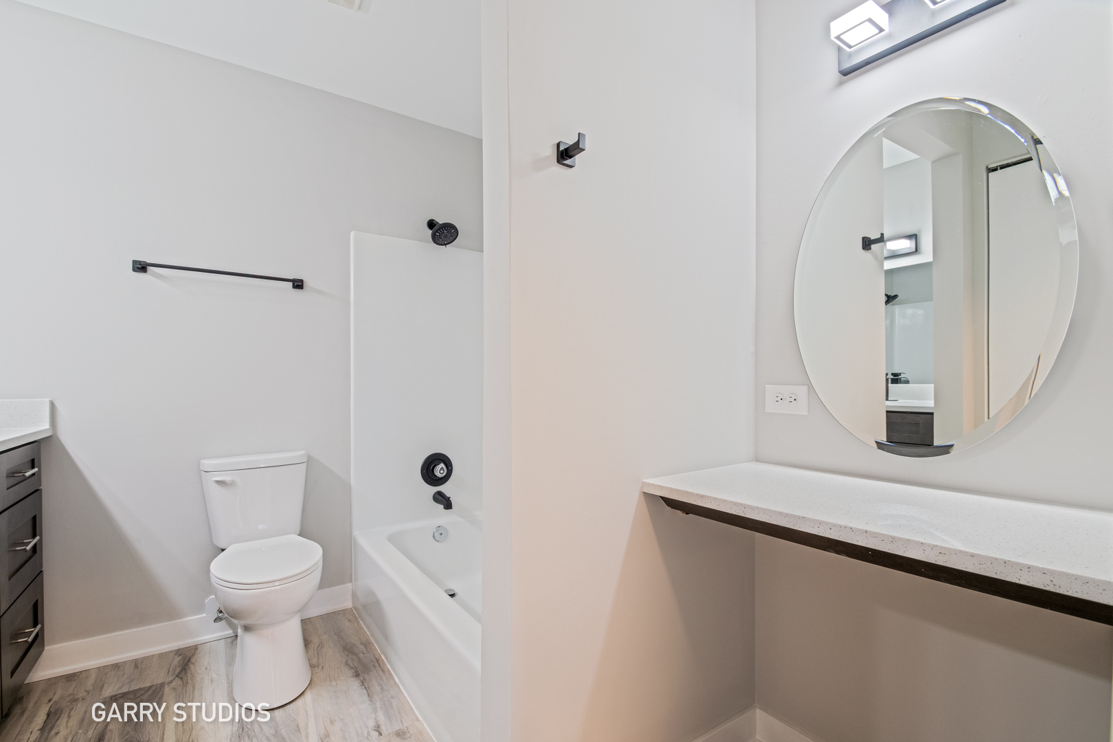 1460 Stonebridge Circle, Unit G9 Wheaton, IL 60189 - Photo 9 of 14 a bathroom with a toilet sink and mirror