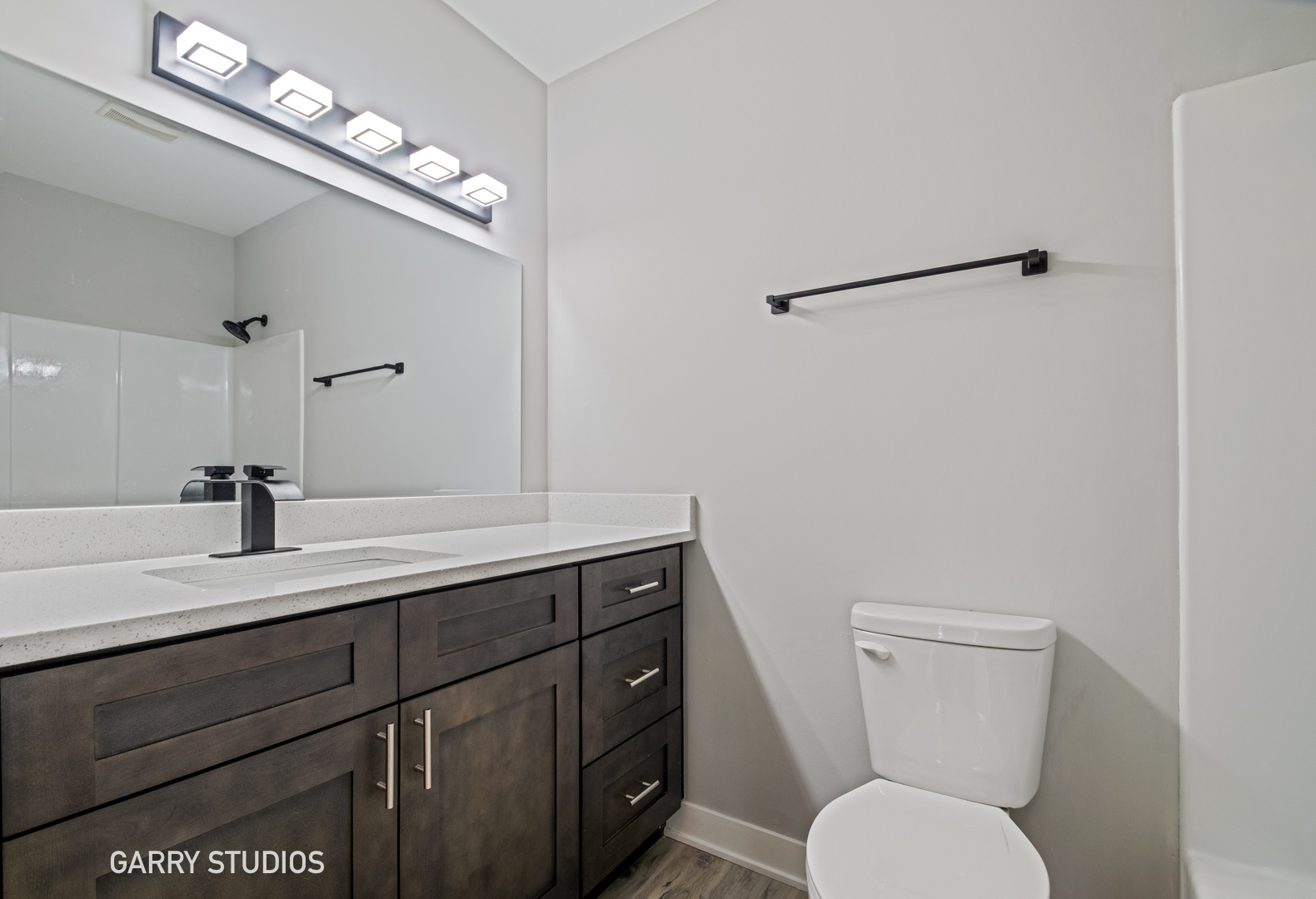 1460 Stonebridge Circle, Unit G9 Wheaton, IL 60189 - Photo 10 of 14 a bathroom with a toilet a sink and mirror