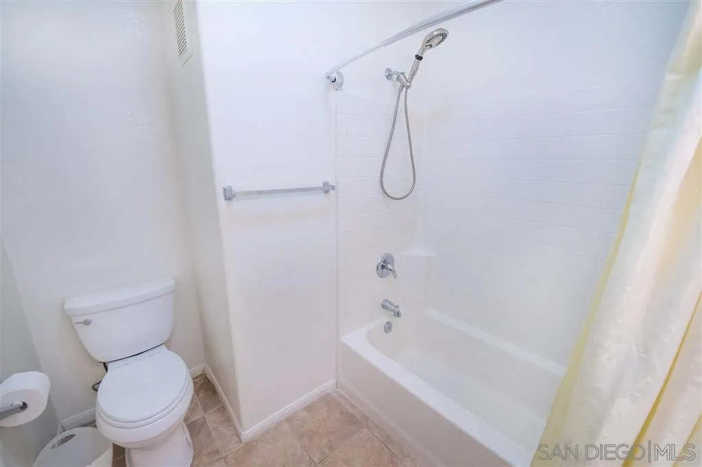 3267 Dehesa Road, Unit 65 El Cajon, CA 92019 - Photo 17 of 25 a white toilet sitting next to a bath tub