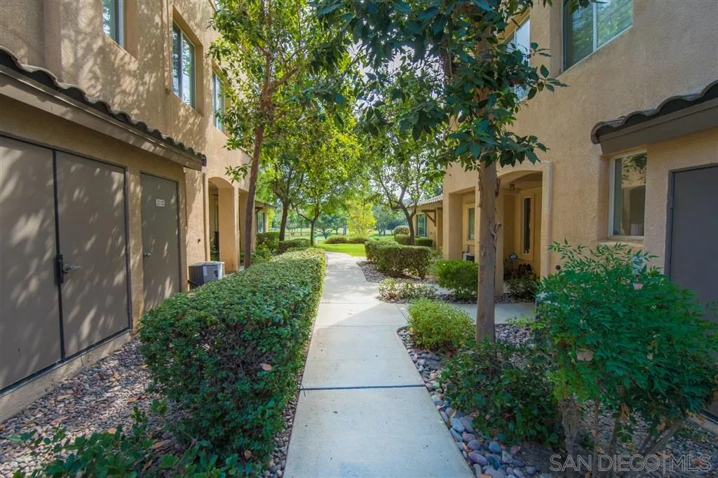 3267 Dehesa Road, Unit 65 El Cajon, CA 92019 - Photo 2 of 25 a view of a pathway with house on both side
