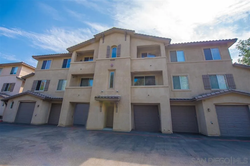 3267 Dehesa Road, Unit 65 El Cajon, CA 92019 - Photo 4 of 25 a large brick building with many windows