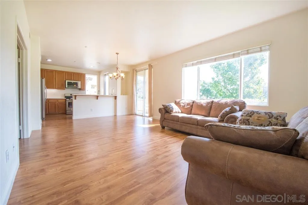 3267 Dehesa Road, Unit 65 El Cajon, CA 92019 - Photo 7 of 25 a living room with furniture and a large window