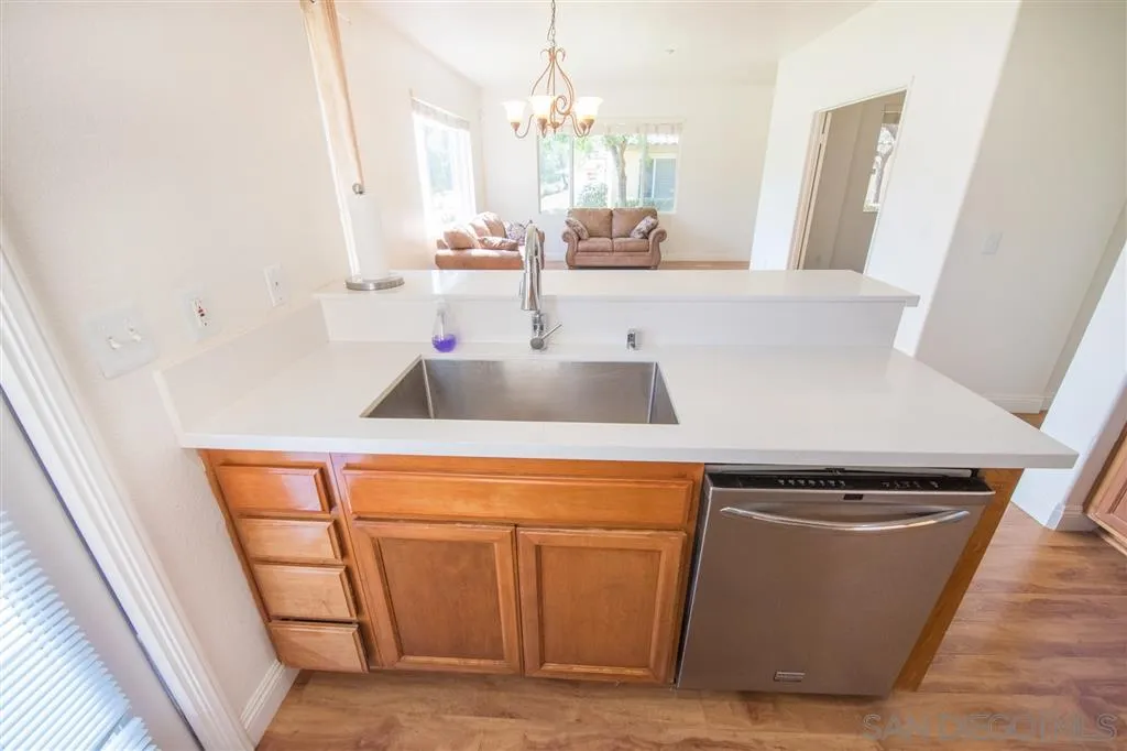 3267 Dehesa Road, Unit 65 El Cajon, CA 92019 - Photo 10 of 25 a kitchen with a sink and a refrigerator