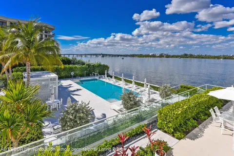 an aerial view of a house with a lake view