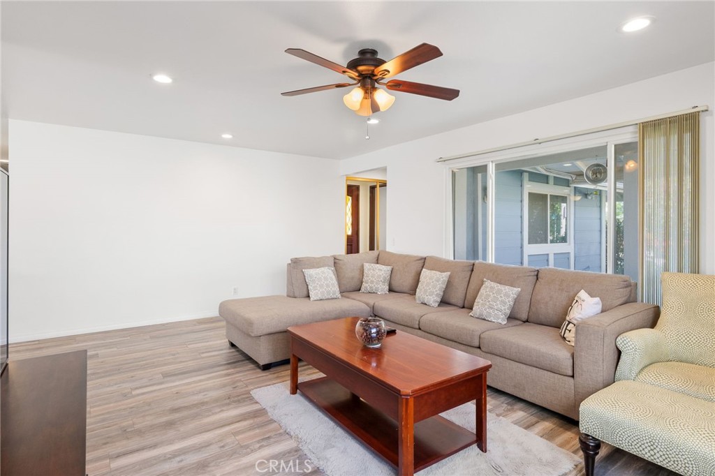 8548 Turlock Drive Riverside, CA 92504 - Photo 11 of 56 a living room with furniture and a ceiling fan