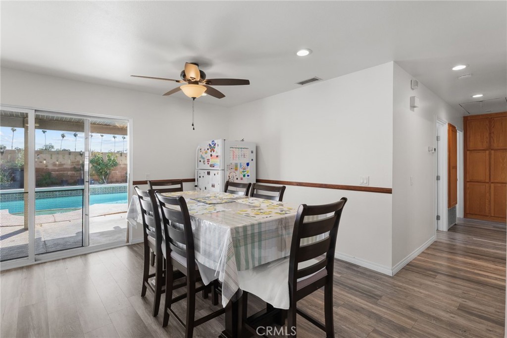 8548 Turlock Drive Riverside, CA 92504 - Photo 13 of 56 a view of a dining room with furniture window and wooden floor