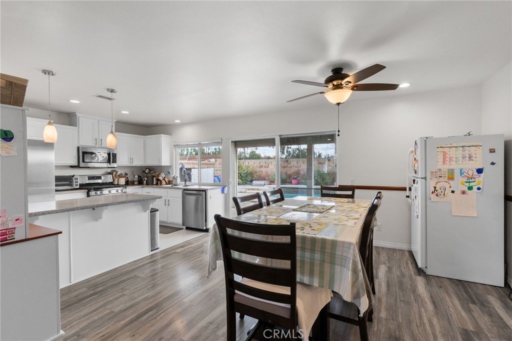 8548 Turlock Drive Riverside, CA 92504 - Photo 16 of 56 a view of kitchen with cabinets and wooden floor