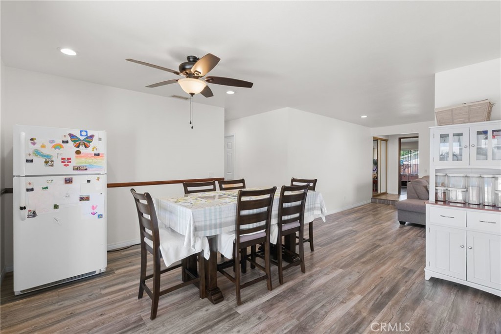 8548 Turlock Drive Riverside, CA 92504 - Photo 18 of 56 a view of a dining room with furniture and wooden floor