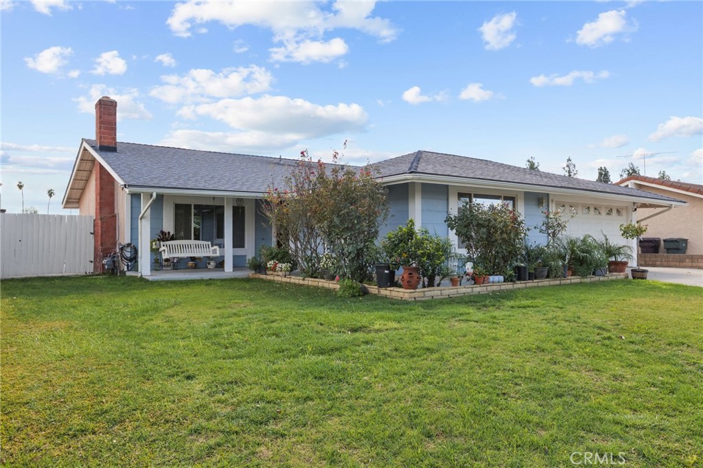8548 Turlock Drive Riverside, CA 92504 - Photo 2 of 56 a view of a house with backyard and garden