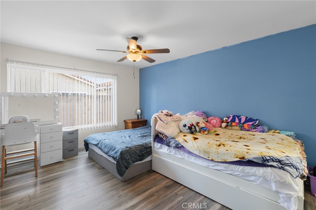 8548 Turlock Drive Riverside, CA 92504 - Photo 30 of 56 a bedroom with a bed and dresser