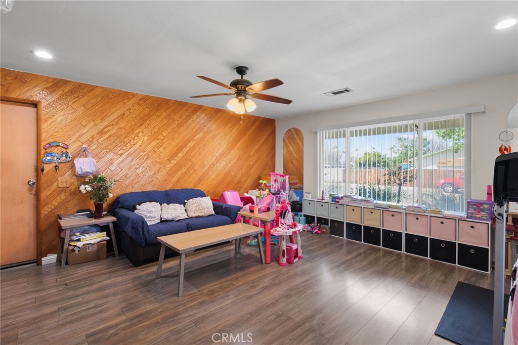 8548 Turlock Drive Riverside, CA 92504 - Photo 37 of 56 a living room with furniture and a wooden floor