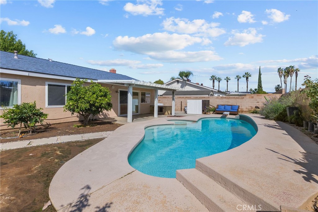 8548 Turlock Drive Riverside, CA 92504 - Photo 44 of 56 front view of a house with a yard